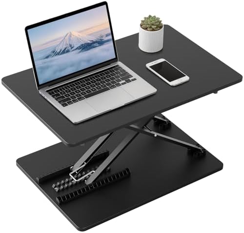 Standing desk converter with laptop and smartphone on black adjustable riser