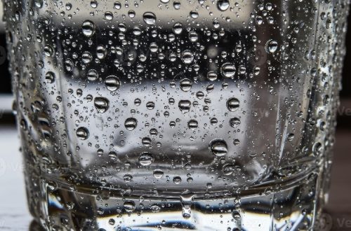 Close-up of water droplets condensation on cold glass surface